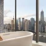 A bathroom with city views at the Hotel Indigo Shanghai